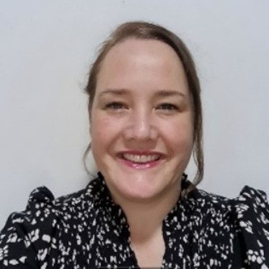 Staff portrait of the Assistant Principal in an office.