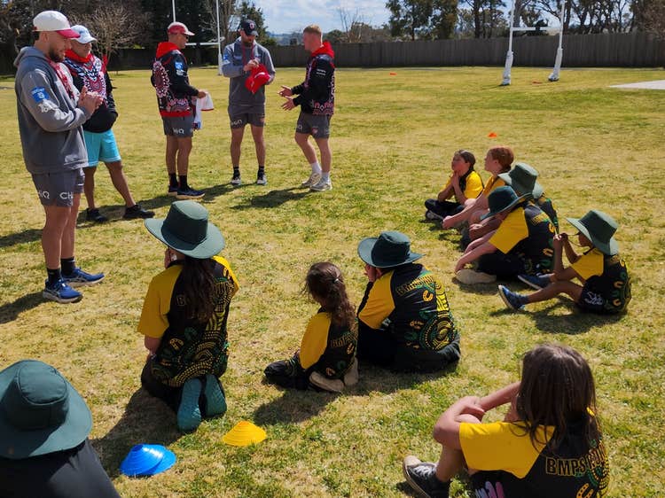 Students sitting and listening.
