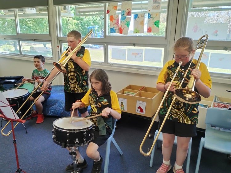 Students playing their instruments.