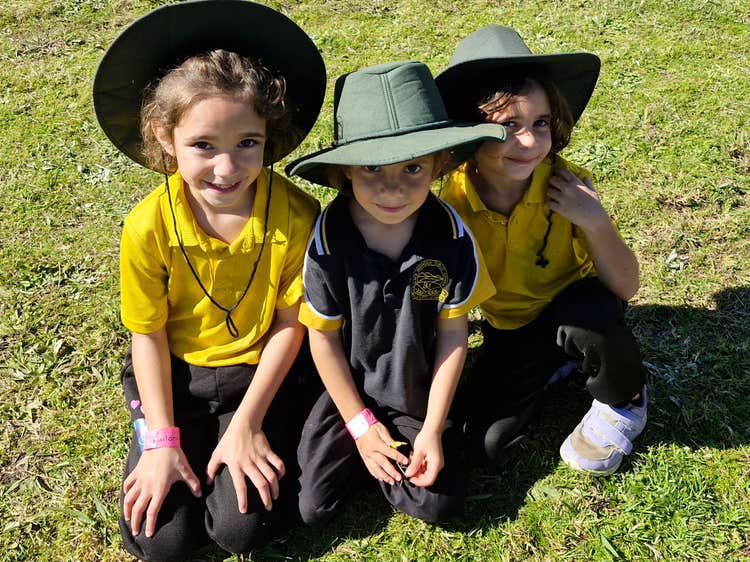 Three girls sitting together.