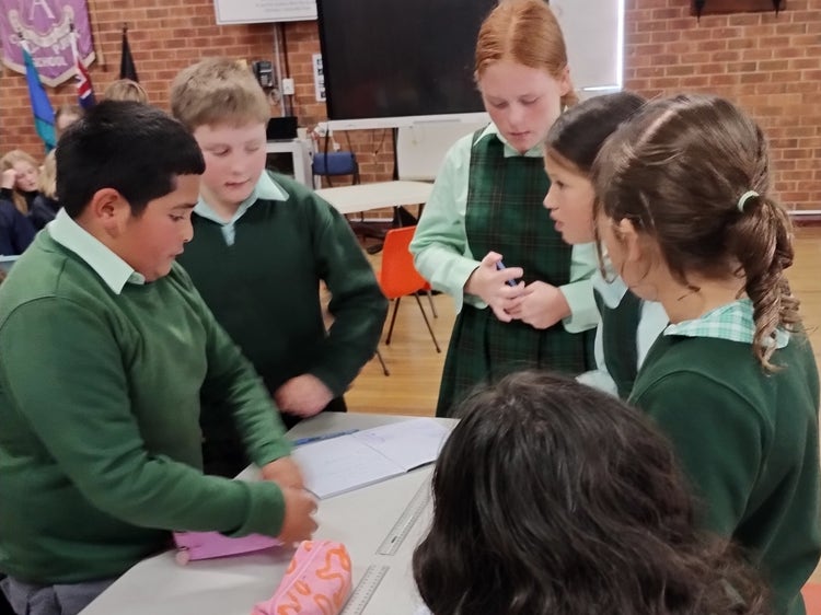 A group of students discuss their ideas.